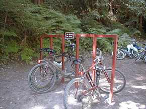 Bikerack at trail end; you hike in from here to the falls.